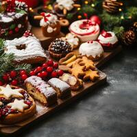 Christmas dessert assortment featuring cookies, cakes, and festive treats on a rustic holiday table photo