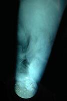 Blue spotlight and smoke photo
