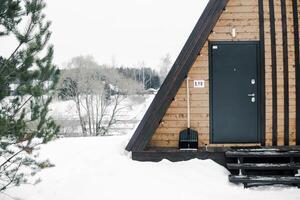 A country house in nature in winter. Rest in an ecologically clean place in winter. Glamping in nature. photo