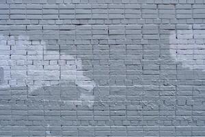 The old wall is unevenly painted. Abstract construction background. photo