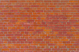 Texture of an old red brick wall. Abstract construction background. photo