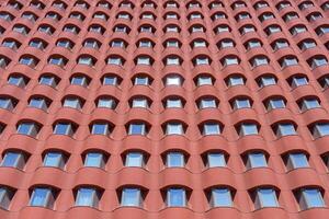 Rows of windows in a modern building. Construction abstract background. photo