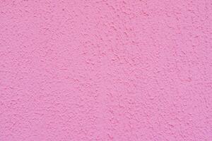 Texture of rough pink plaster. Architectural abstract background. photo