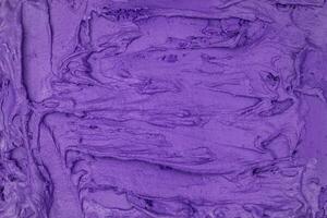Blueberry ice cream texture. Top view. Delicious cool treat. photo