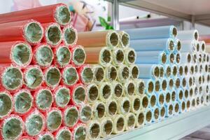 A roll of wrapping paper on a shelf in a store. photo