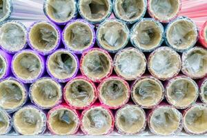 A roll of wrapping paper on a shelf in a store. photo