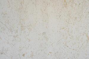 Peeled plaster on the wall. Abstract construction background. photo
