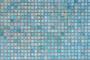 Wall of small blue tiles. Abstract design background. photo