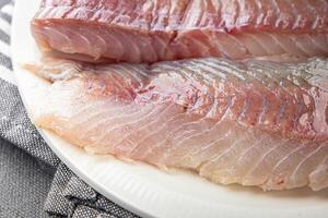 fillet raw white fish cod or halibut fresh meal food snack on the table copy space food background rustic top view photo