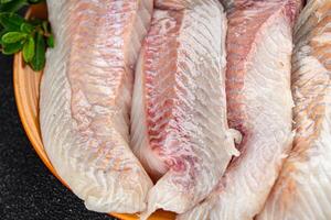 fillet raw white fish cod or halibut fresh meal food snack on the table copy space food background rustic top view photo