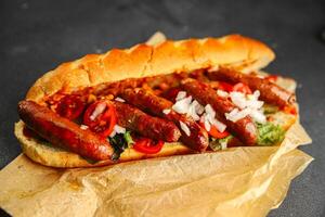 hot dog sausages, bun, greens, sauce fast food delicious food dish Fresh delicious gourmet food background on the table rustic food top view copy space photo