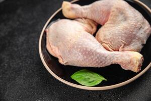 raw chicken legs chicken quarter meat poultry flesh gourmet meal food snack on the table copy space food background rustic top view photo
