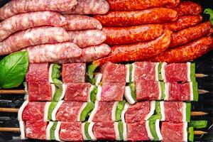 raw sausage meat assorted juicy pork, beef fresh delicious gourmet food background on the table photo