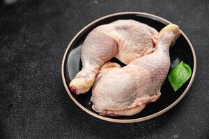 raw chicken legs meat chicken thighs poultry flesh on the bone gourmet fresh meal food snack photo