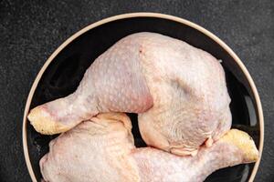 raw chicken legs meat chicken thighs poultry flesh on the bone gourmet fresh meal food snack photo