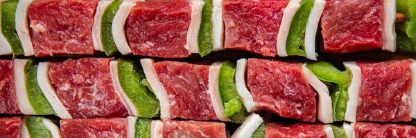 kebab raw meat fresh vegetables pork, lard, pepper, vegetable dish gourmet food background on the table rustic food top view copy space photo
