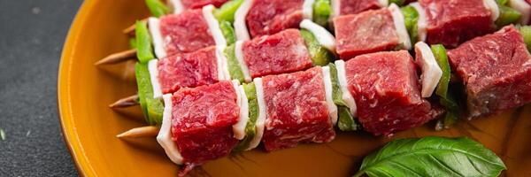 kebab raw meat fresh vegetables pork, lard, pepper, vegetable dish gourmet food background on the table rustic food top view copy space photo