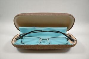 Reading glasses in the case, serving as an aid to reading and also as fashion photo