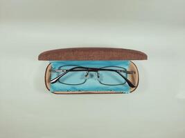 Reading glasses in the case, serving as an aid to reading and also as fashion photo