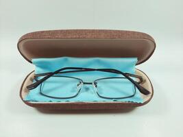 Reading glasses in the case, serving as an aid to reading and also as fashion photo