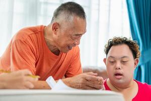 Senior man and grandchild practice math skill, interactive math game, Grandfather supervising grandchild sitting at sofa doing homework photo