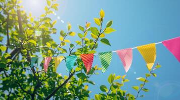 Captivating Colorful Pennant String Adorning Verdant Green Tree Foliage photo