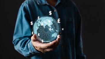 A person hold global currency to plan in e-business, the use of online digital network technology in business, buying and selling commerce online digital marketplace photo
