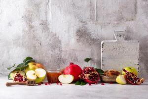 Rosh Hashana concept with honey, apple and pomegranate photo