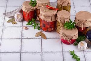 Pickled vegetables in glass jars. photo