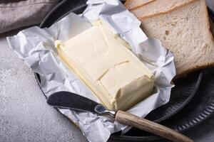 Fresh butter on grey backgrouns. photo