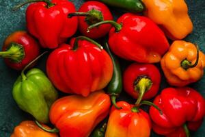 Colorful peper on green background photo