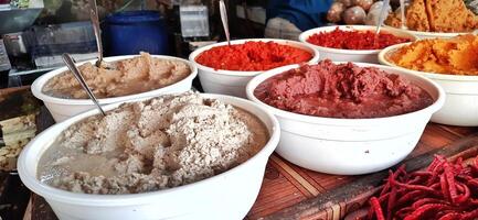 Various herbs and spices are sold in traditional markets photo