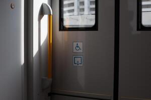 Ramp icon for signal to exit train for people with disabilities, accessibility of use of ramp in public transport for people with disabilities, pictogram of ramp for convenience of wheelchair user photo