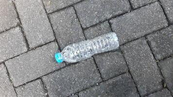 A plastic bottle on the ground photo