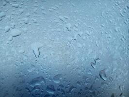 A window with water droplets on it photo
