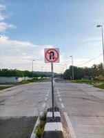 A no parking sign on a street corner photo