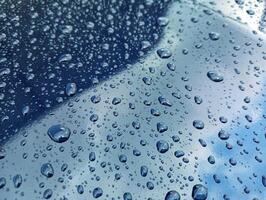 A close up of rain drops on a window photo