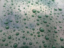 Water droplets on the glass of a car photo