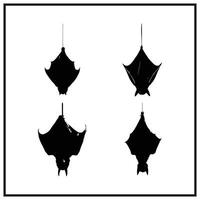 A Halloween bat hanging upside down silhouette vector