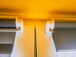 Window roller, duo system day and night. Dual roller shades beige color close-up photo