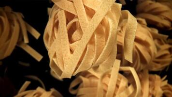 The tagliatelle pasta flies up. Filmed on a high-speed camera at 1000 fps. High quality FullHD footage video