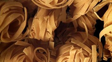 The tagliatelle pasta flies up. Filmed on a high-speed camera at 1000 fps. High quality FullHD footage video