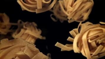 The tagliatelle pasta falls down. Filmed on a high-speed camera at 1000 fps. High quality FullHD footage video