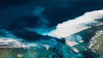 Coastline with ocean waves and current canal and Green bowl beach, drone view photo