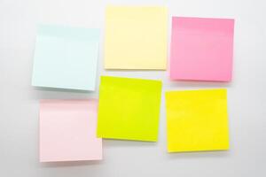 A different colored sheets of note papers or sticky note. blank Sticker notes. Mockup sticky Note Paper. empty sheets for notes on board. photo
