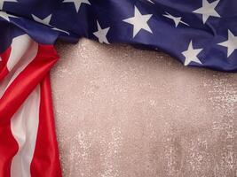 Top view of the American flag on a cement floor with copy space for text. photo