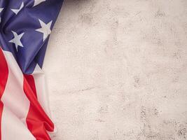 Top view of the American flag on a cement floor with copy space for text. photo