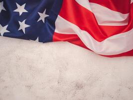 Top view of the American flag on a cement floor with copy space for text. photo