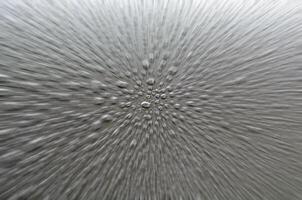 Straight view of raindrops on dark cover background with zoom in effect photo