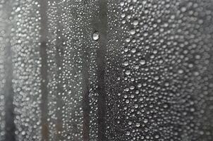 Small rain droplets on dark cover background. Suitable for wallpaper background photo